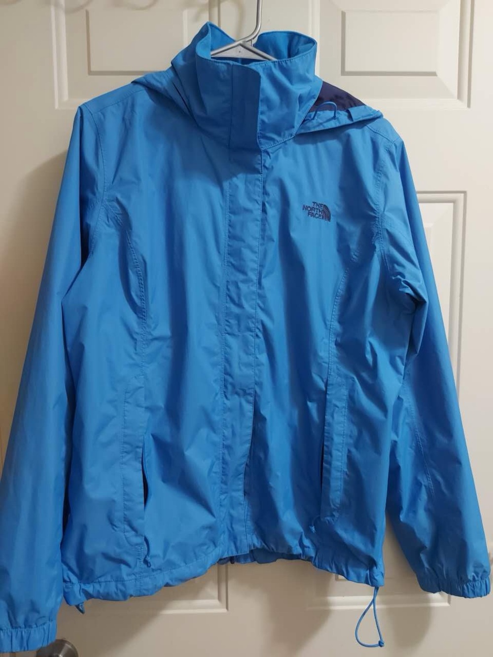 The North Face blue windbreaker